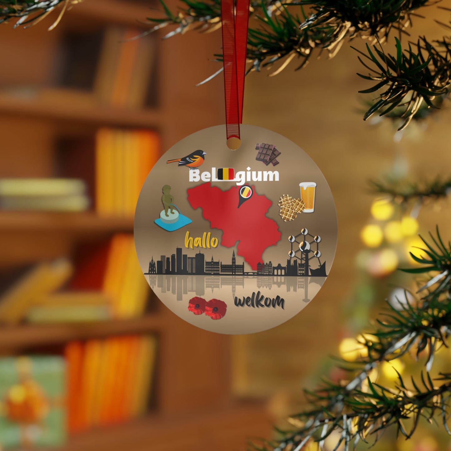 Decorative Christmas ornament with Belgian symbols hanging on a tree.