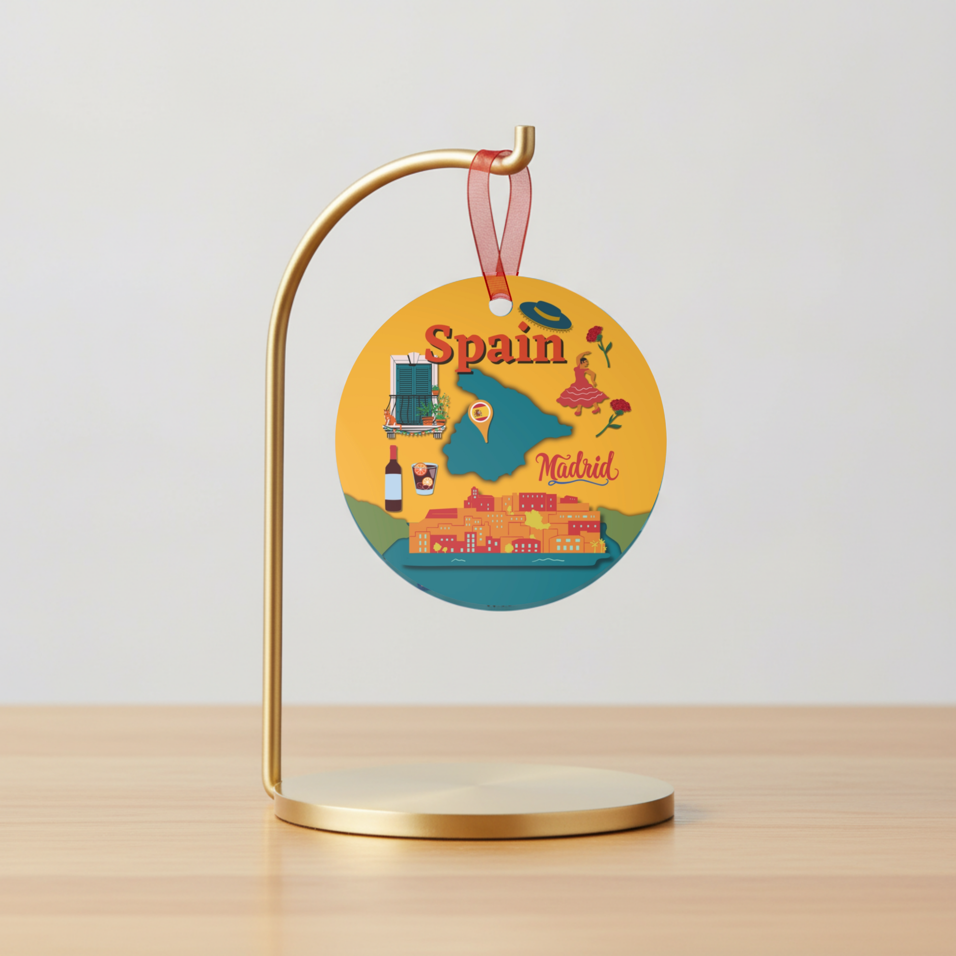 Decorative round sign with 'Spain' and 'Madrid' on a gold stand against a light gray background.