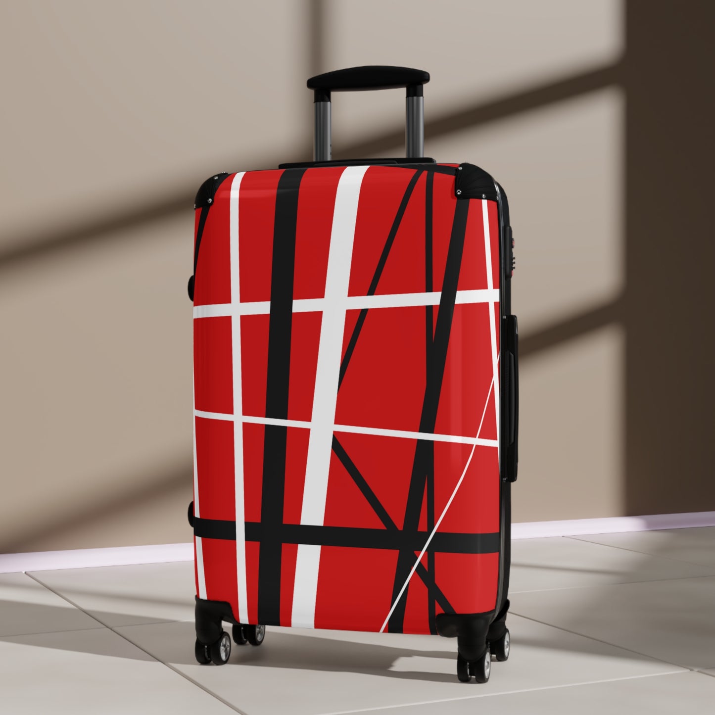 Red suitcase black white random stripes in lobby