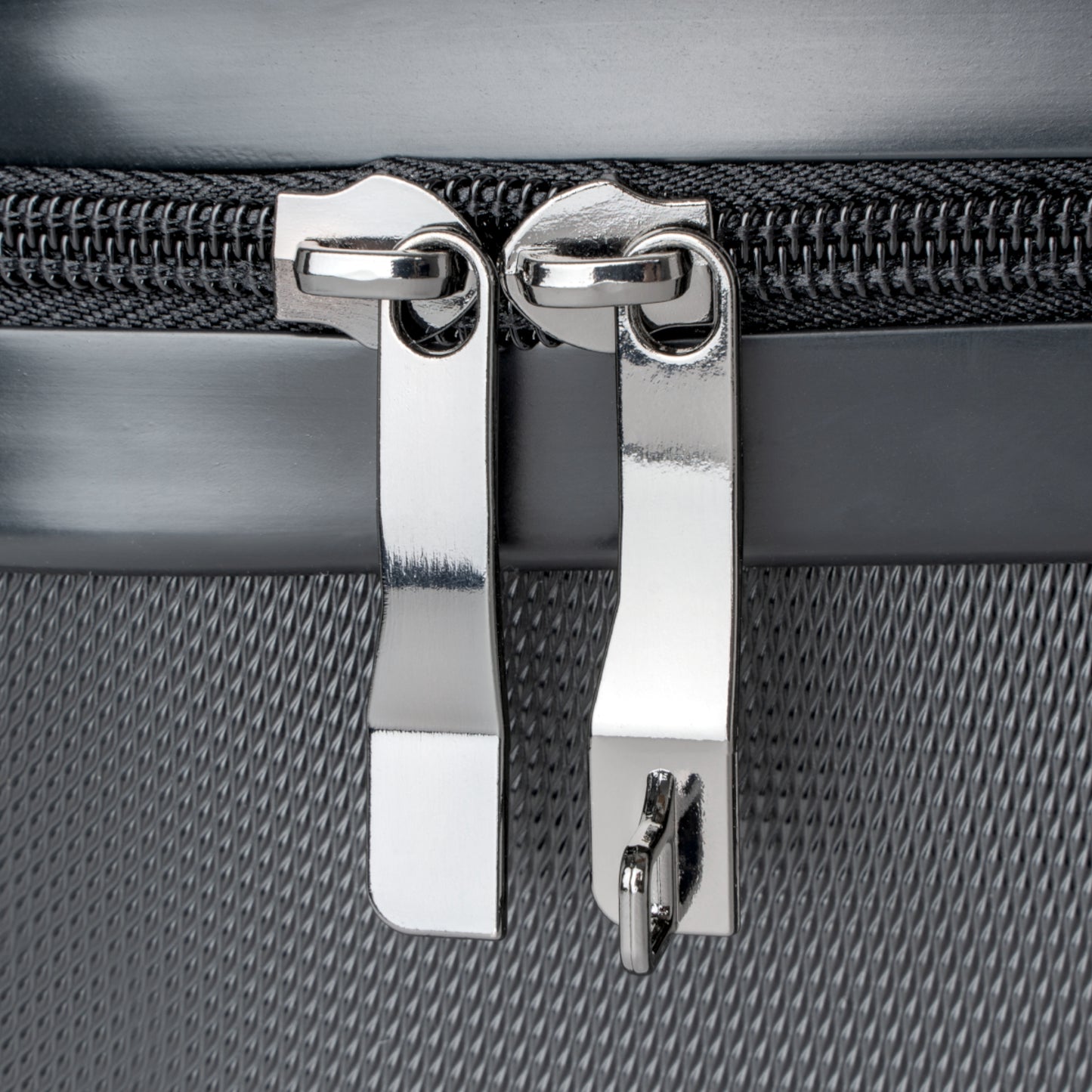 detail of stainless steel suitcase zipper