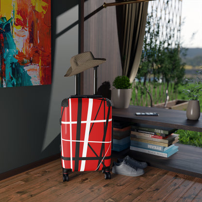 Red suitcase black white random stripes in loft apartment