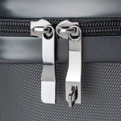Details of stainless steel zipper tabs of suitcase