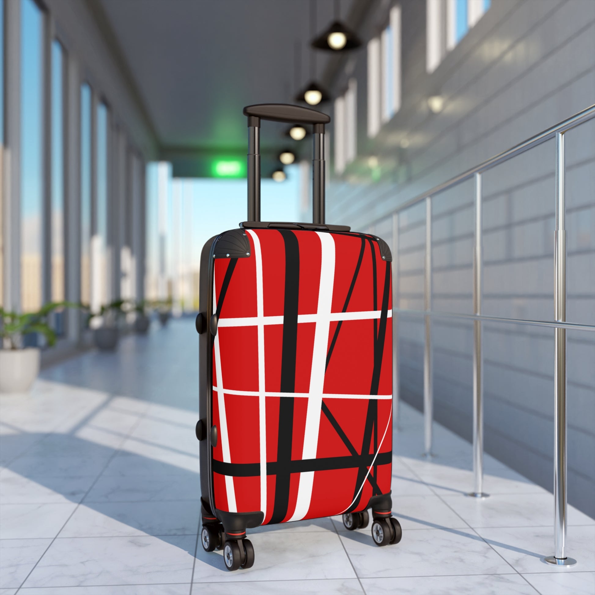 Red suitcase black white random stripes in airport