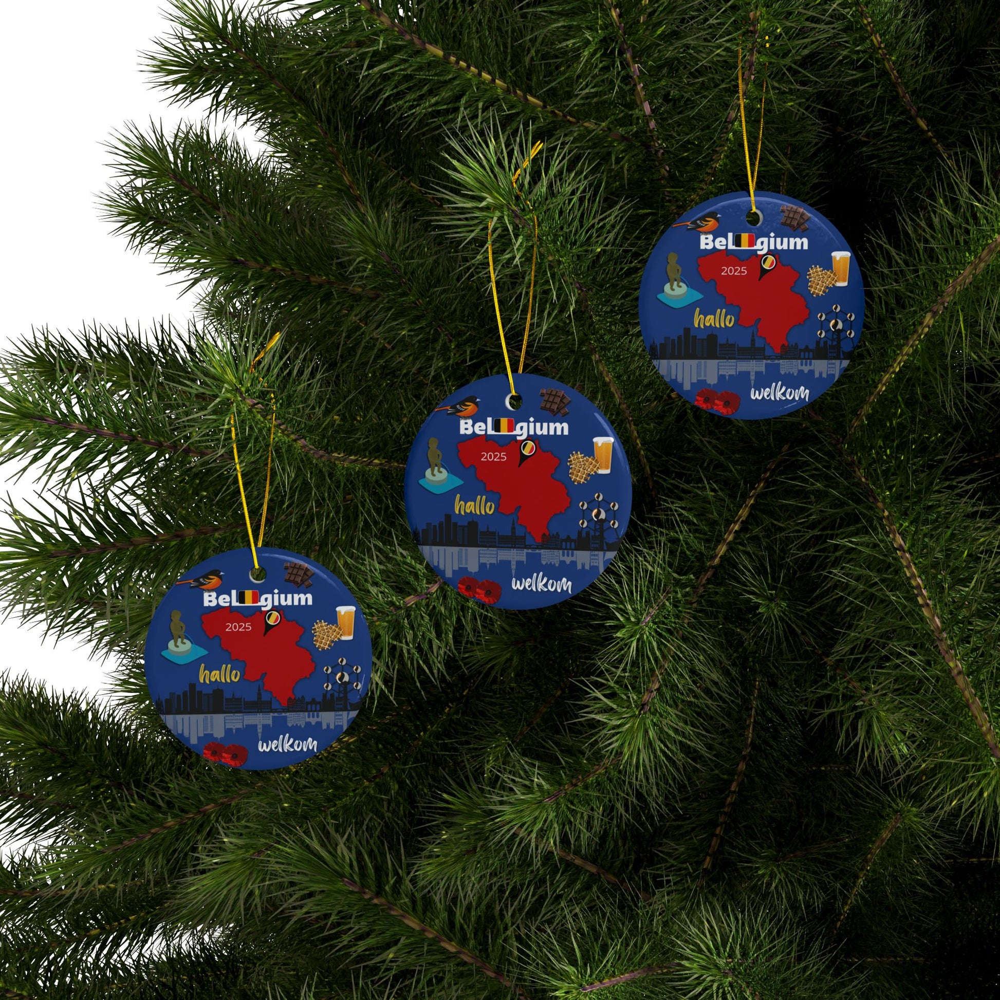 Three Belgium-themed Christmas ornaments hanging on a tree.
