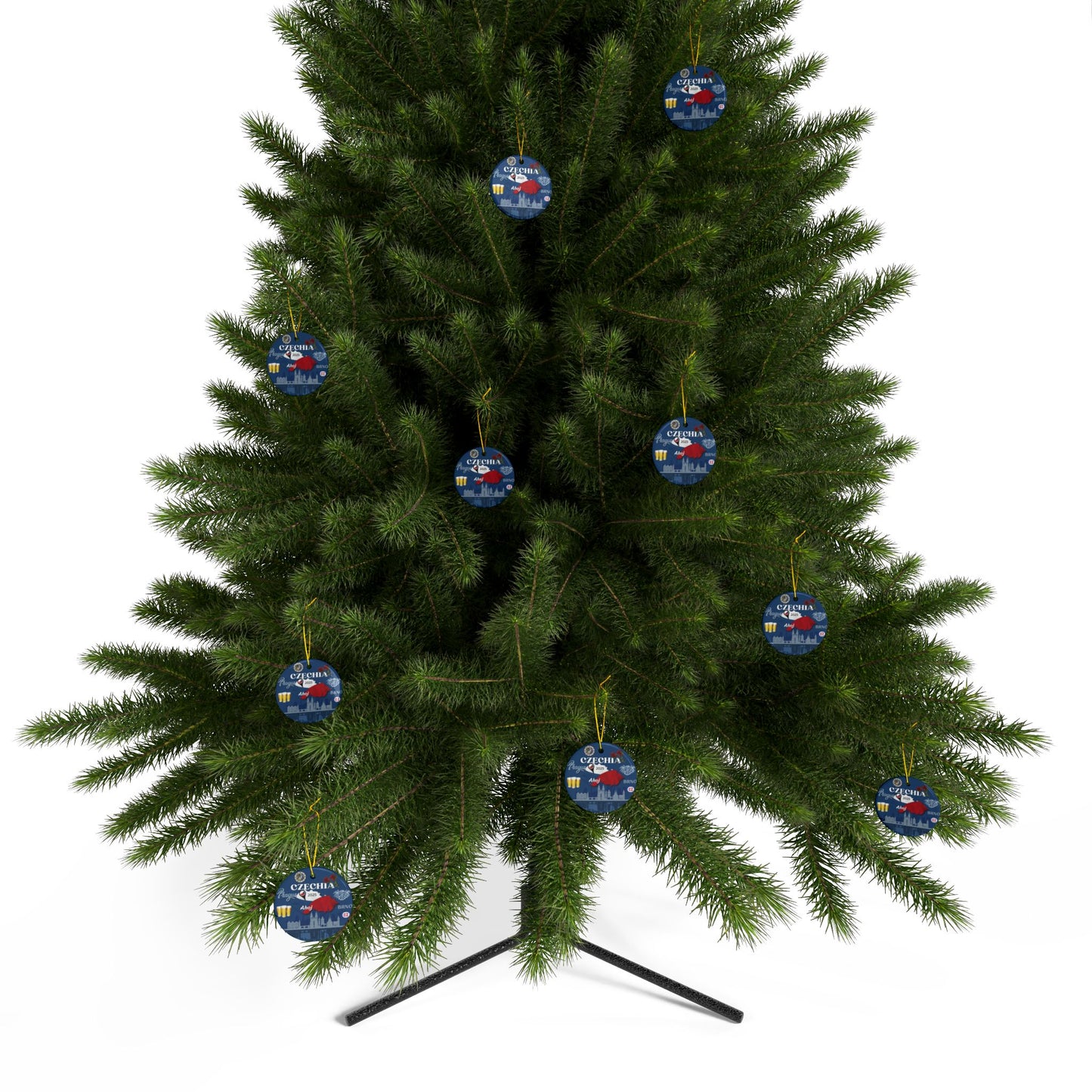 Green Christmas tree with blue and red ornaments on a white background