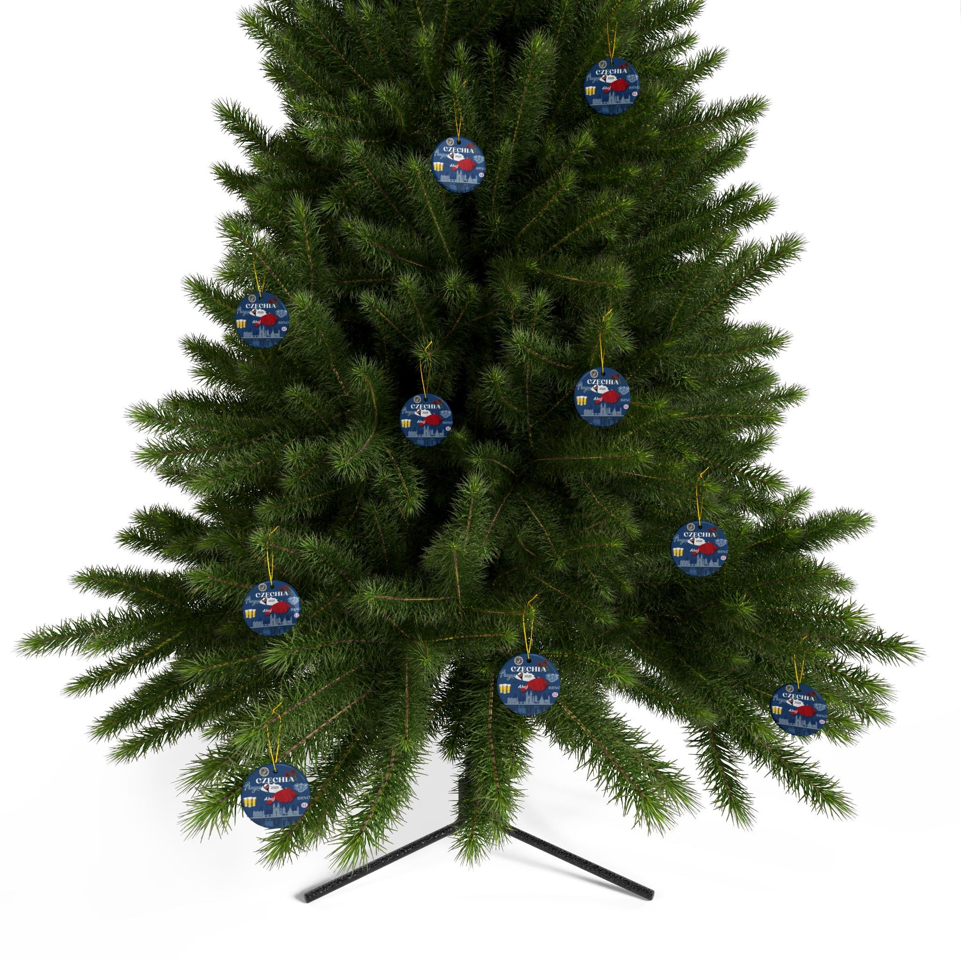 Green Christmas tree with blue and red ornaments on a white background