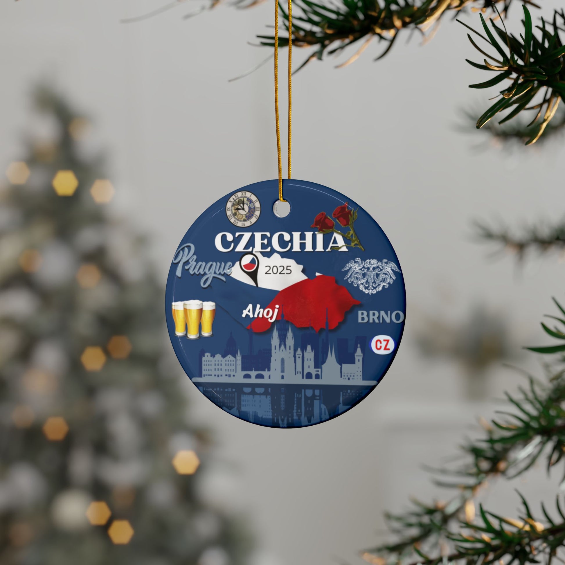 Decorative Christmas ornament with Czechia-themed design hanging on a tree.