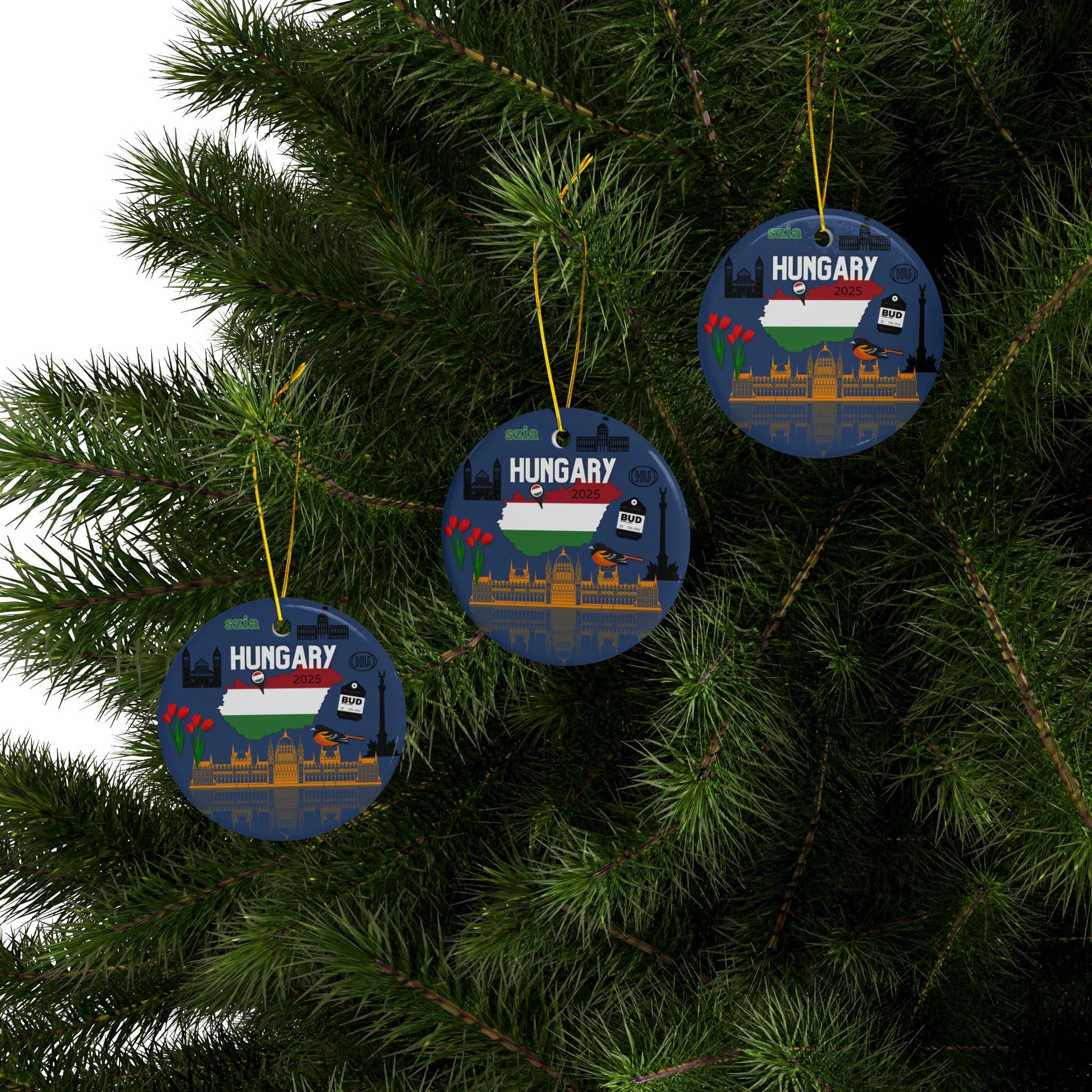 Three circular ornaments with Hungarian design hanging on a Christmas tree.