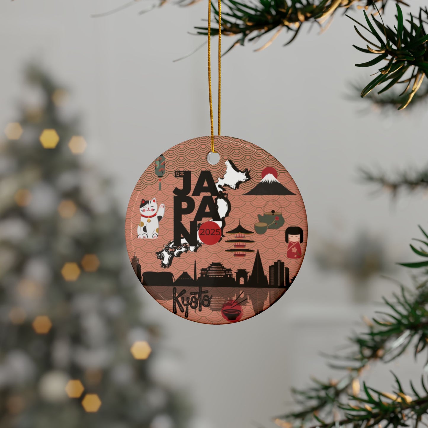 Decorative ornament with Japanese-themed design hanging on a tree branch.