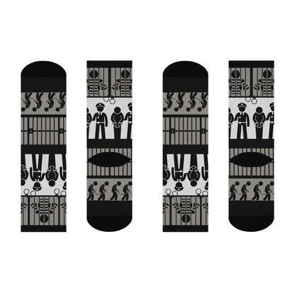 A pair of crew socks with a mid-calf height featuring a black and white pattern with law enforcement and legal-themed graphics.