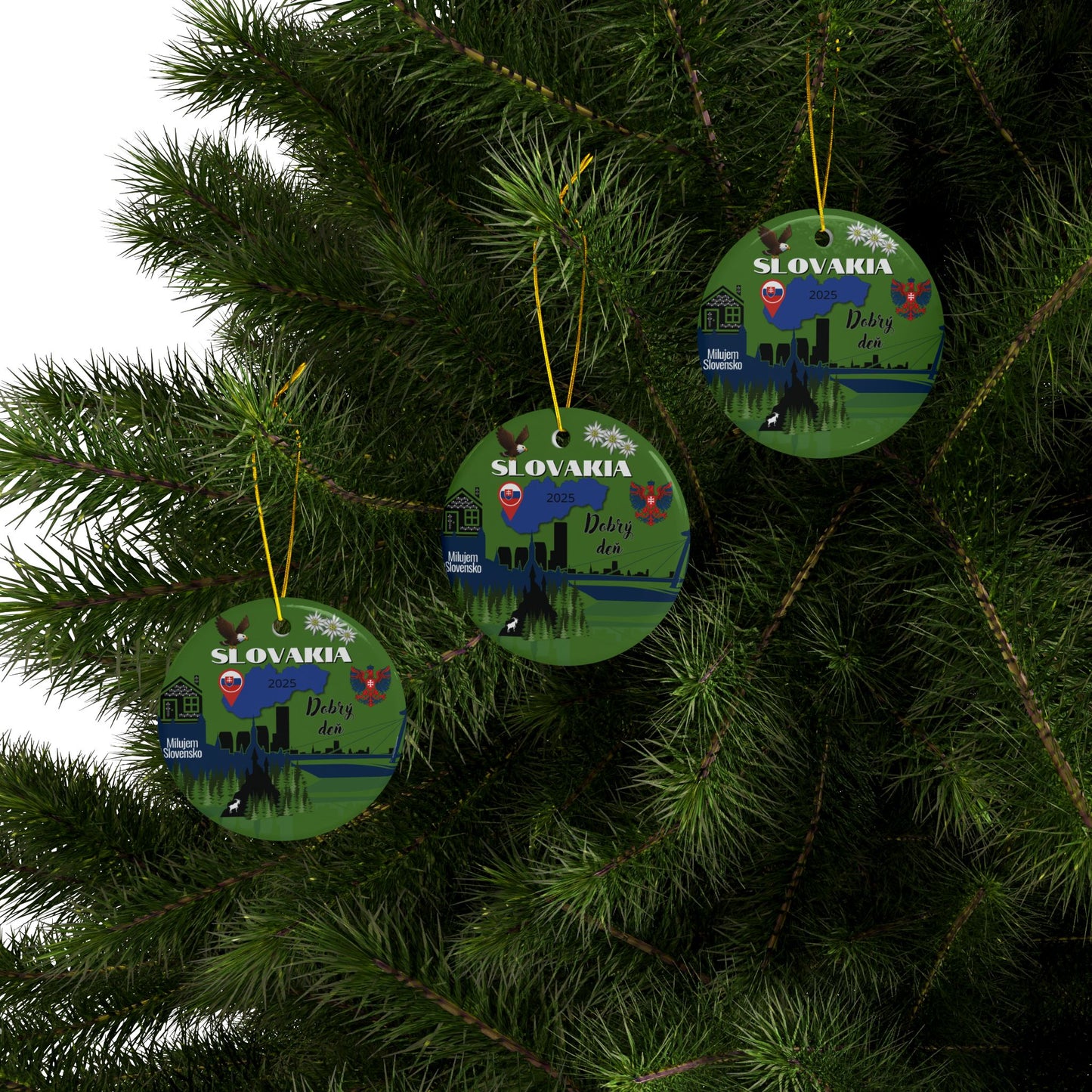 Three green Christmas ornaments with Slovakian design hanging on a tree.