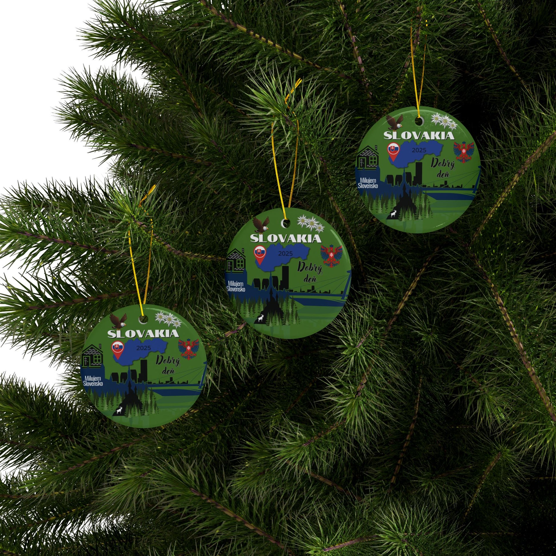 Three green Christmas ornaments with Slovakian design hanging on a tree.