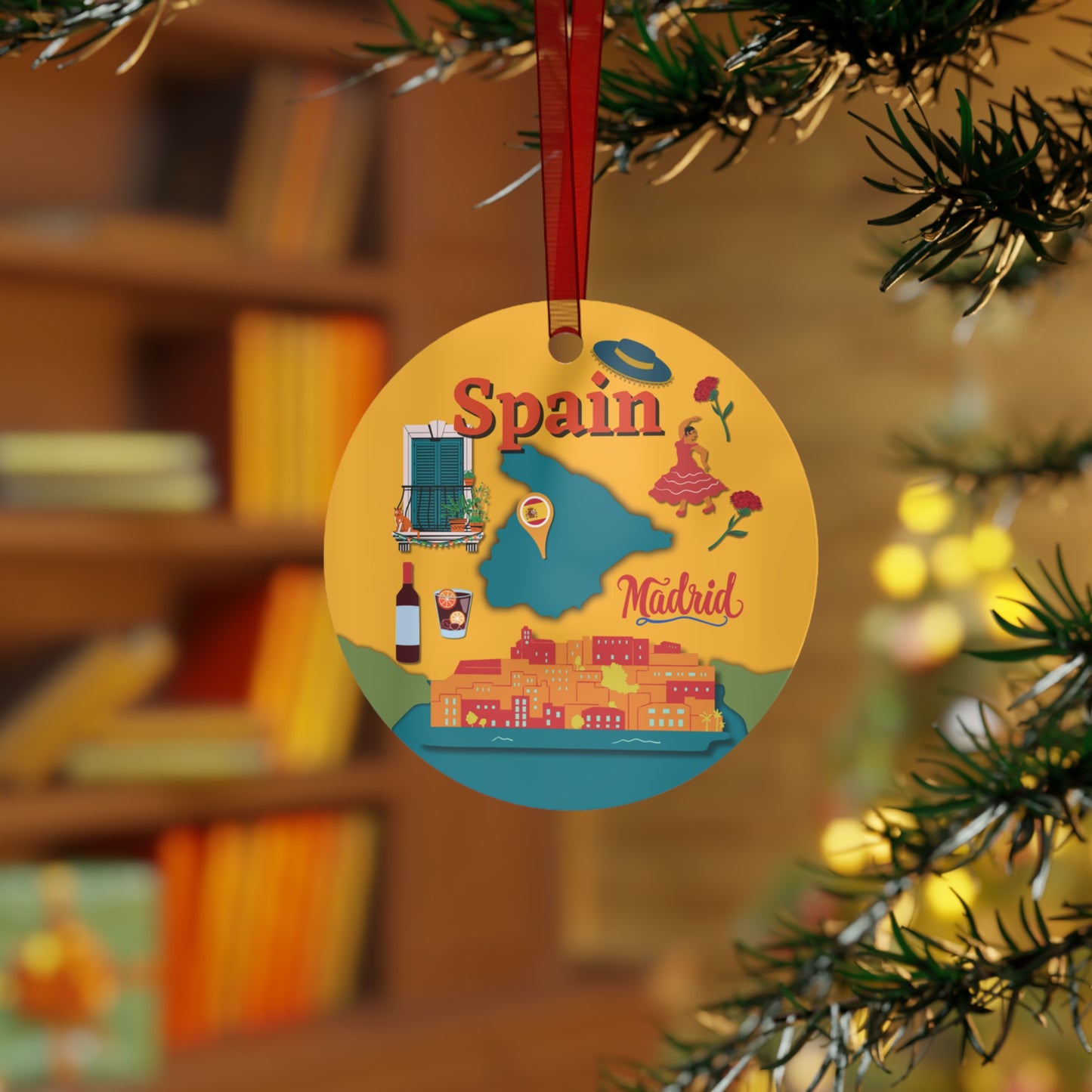 Decorative ornament with Spain and Madrid design hanging on a tree branch.