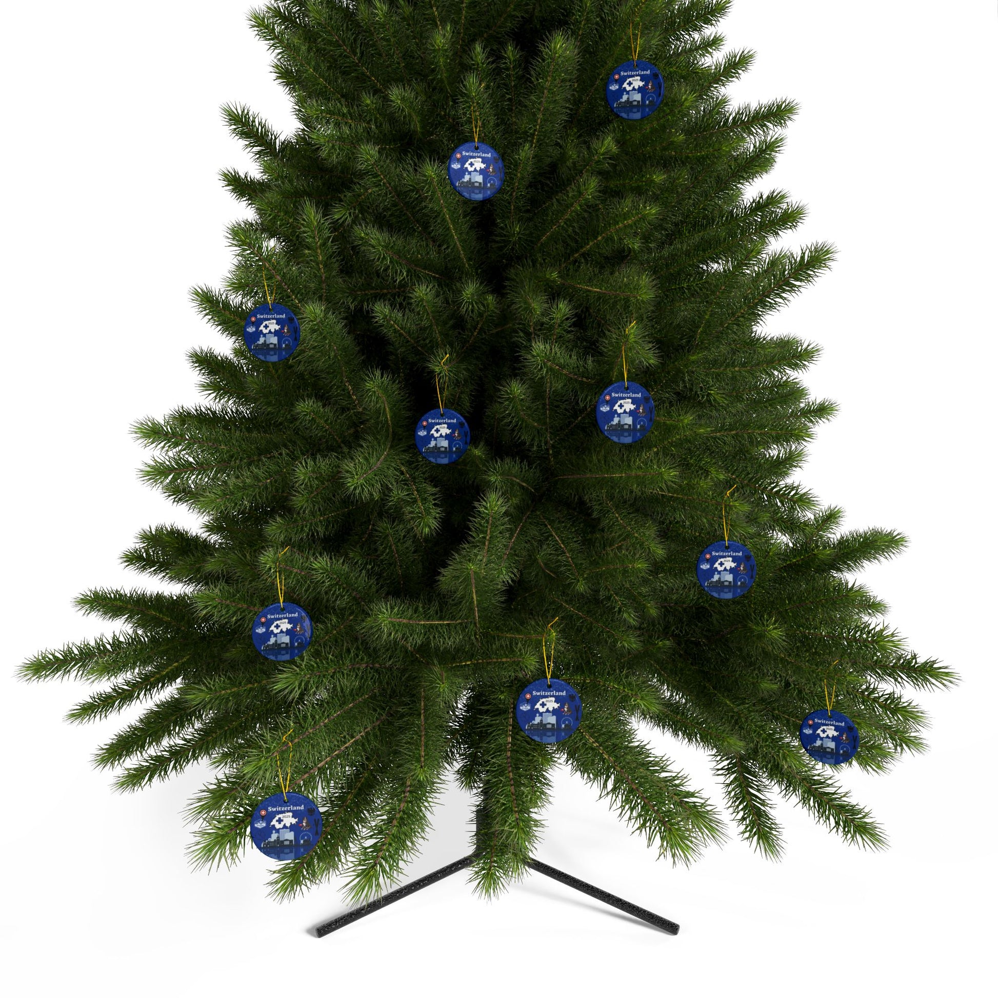 Green Christmas tree with blue ornaments on a white background